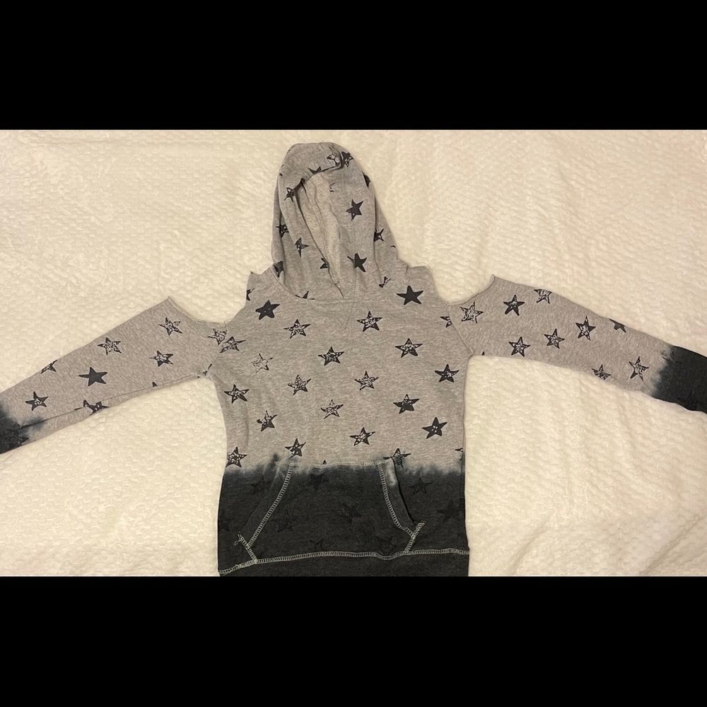 Grey and navy blue hoodie with stars.